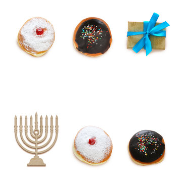 jewish holiday Hanukkah image with traditional doughnuts isolated and menorah (traditional candelabra) on white.