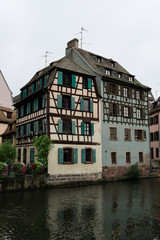 Fototapeta na wymiar Old house near a canal in Strasbourg, France, with flowers