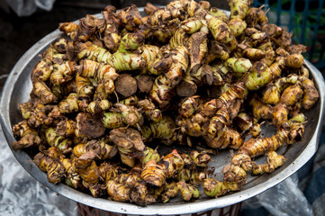 Fresh Alpinia Galangal on tray selling in wet market