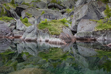 Mirror reflections in Lake Harmony in the high mountains of Ergaki, Russia