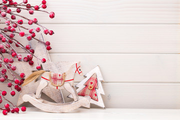 Christmas decor on the wooden white background.