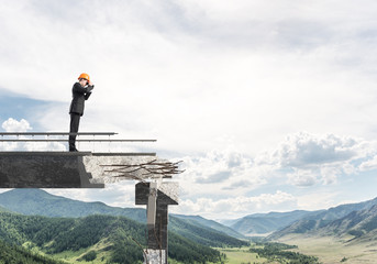 Man in suit looking up for new ideas.