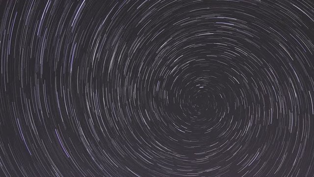 Timelapse of moving star trails in night sky.