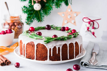 Christmas fruit cake, pudding on white plate. Copy space.