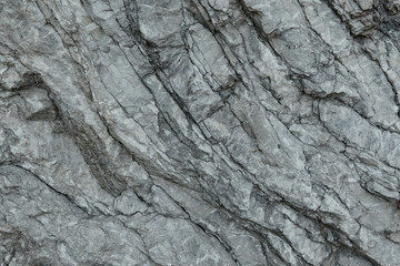 Aged gray stone macro, granite texture closeup