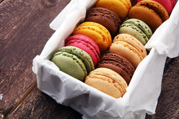 Different types of macaroons or macarons in a box.