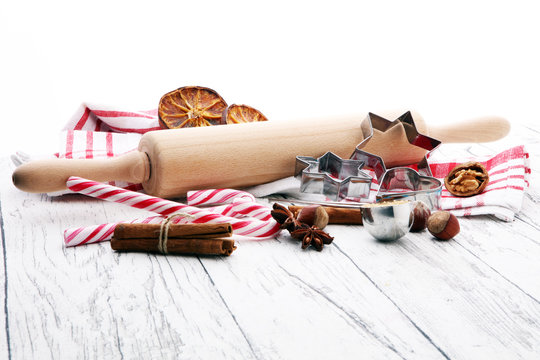 Ingredients for Christmas baking - spices, nuts, cookies and shape cookie cutters. Seasonal, food background