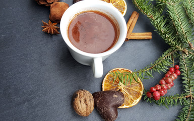 Obraz na płótnie Canvas Christmas background with fir tree, nuts and hot chocolate