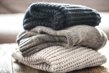 Fototapeta na wymiar stack of cozy knitted sweaters