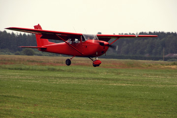 Fototapeta na wymiar Small private lightweight vintage propeller airplane.