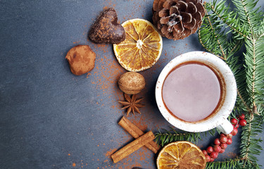 Christmas background with fir tree, nuts and hot chocolate