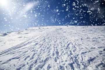 Fototapeta na wymiar Snowy hilside in the mountains