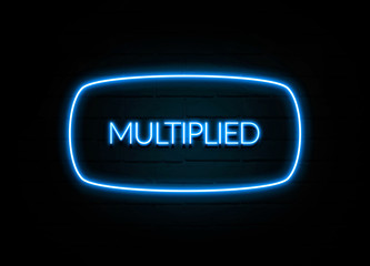 Multiplied  - colorful Neon Sign on brickwall