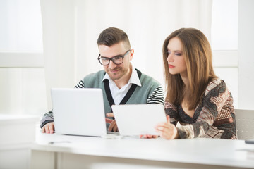 Young coworkers comapring results