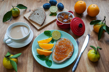 New Year's breakfast, coffee, bread, jam. Festive table setting.