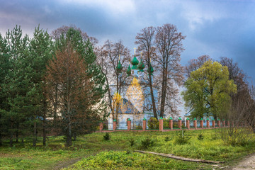 The Russian Orthodox Church on a background of autumn trees.