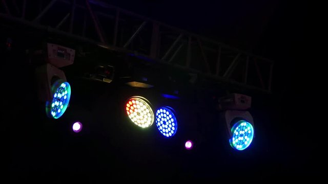 Stage lights and spot lights at a concert, in a circus.