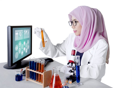 Muslim researcher holds experiment sample