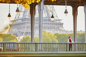 Young woman in Paris on Bir-Hakeim bridge