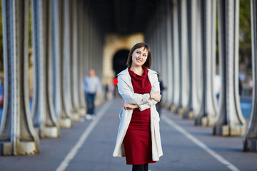 Young woman in Paris on Bir-Hakeim bridge