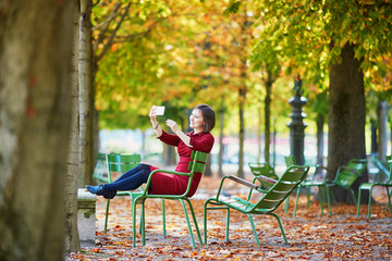 Young woman in Paris on a bright fall day