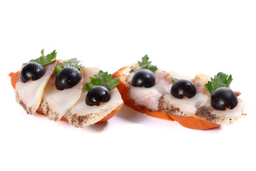 Sandwiches with muksun fish and olives