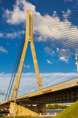 Fototapeta premium RIGA, LATVIA Vansu Bridge over Daugava River in Riga, Latvia. One of five big bridges in Riga and the only cable-stayed