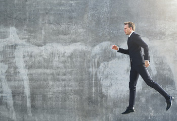 Businessman walking in the air while jumping