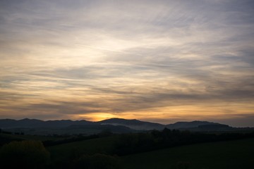 Sunset and sunrise with dramatic colorful clouds. Slovakia