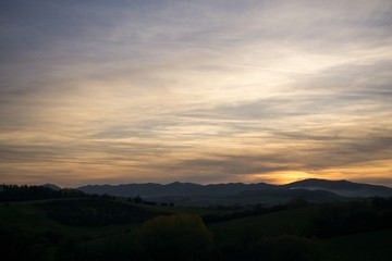 Sunset and sunrise with dramatic colorful clouds. Slovakia