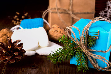 Christmas Happy New Year Holiday Composition with box, cone and walnut on a Wooden Background.