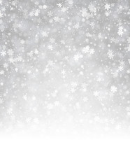 Grey winter background with snowflakes.