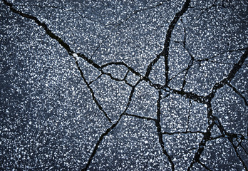asphalt pavement with cracks on the surface - obrazy, fototapety, plakaty
