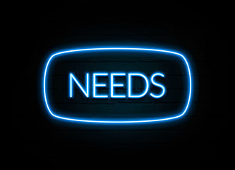 Needs  - colorful Neon Sign on brickwall