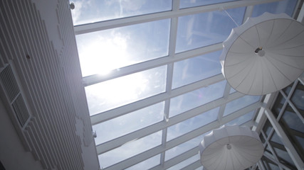View of the sun and blue sky through the window slide motion. Skylights. View from the window. View...