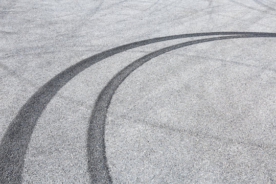 Abstract background black tire tracks skid on asphalt road,high angle shot view in racing circuit