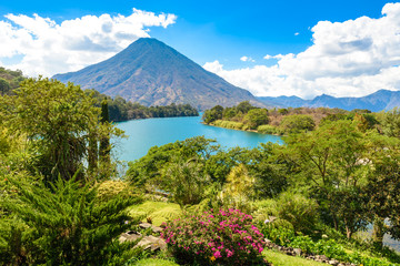 Fototapeta na wymiar Beautiful bay of Lake Atitlan with view to Volcano San Pedro in highlands of Guatemala, Central America