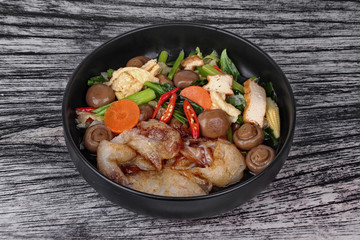 Fried big noodle topped mixed vegetables for organic food.