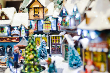 Decorated Christmas children shopping toys on joyful festive shiny blurred light background, closeup image. Seasonal elegant natural classy mood, love peace jolly decor design, traditional bright joy