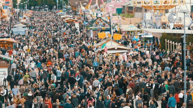 September 17, 2017 - Oktoberfest, Munich, Germany:View of the huge crowd of people walking around the Oktoberfest in national bavarian suits, on Theresienwiese, top view