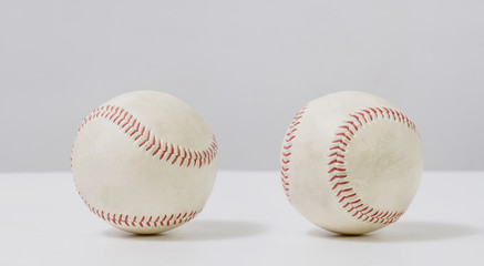 two old white baseball on white background
