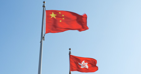 Hong Kong and chinese flag with blue sky