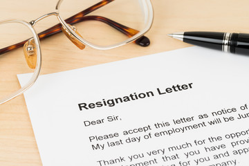 Resignation letter resign with pen and glasses