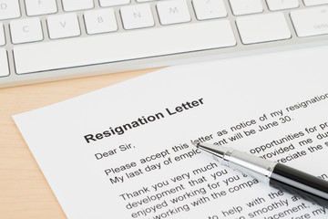 Resignation letter resign with pen and keyboard