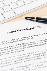 Resignation letter resign with pen and keyboard