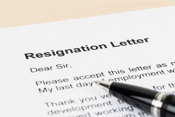 Resignation letter resign with pen