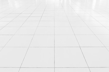 White tile floor background in perspective view. Clean, shiny, symmetry with grid line texture. For decoration in bathroom, kitchen and laundry room. And empty or copy space for product display also.