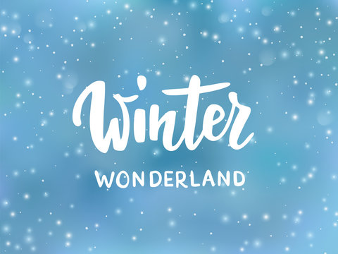 Winter wonderland text, hand drawn brush lettering. Holiday greetings quote. Blue background with falling snow effect. 