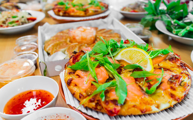 Smoked Salmon Pizza and Gyoza Dumplings, Combination of Popular Eastern and Western Food