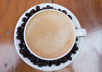 Cup of coffee on wooden table